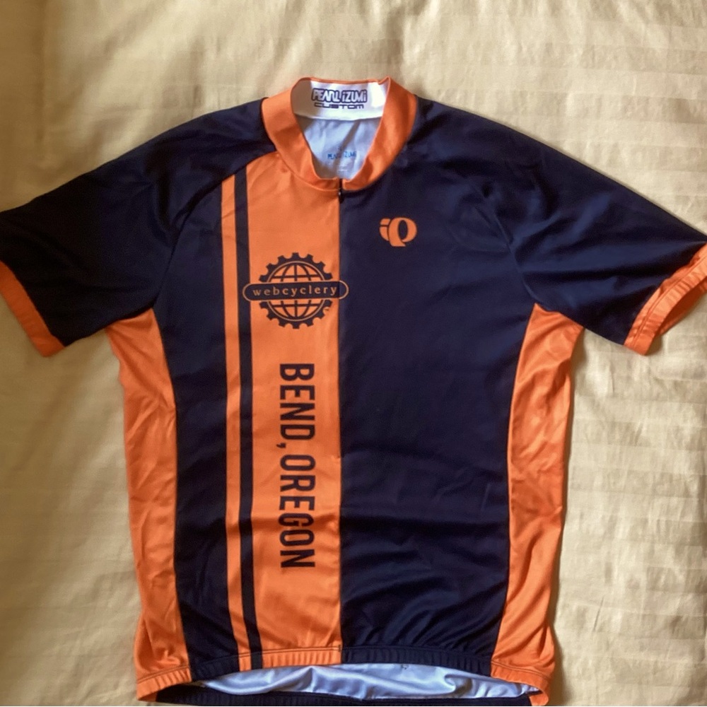 Pearl Izumi Black and Orange Quarter Zip Bike Top. Size Medium. Good Condition.